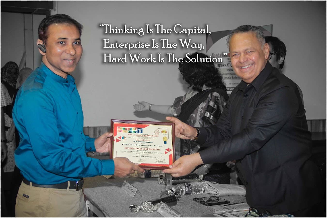 Laptian founder receiving recognition at an international education conference in Pune